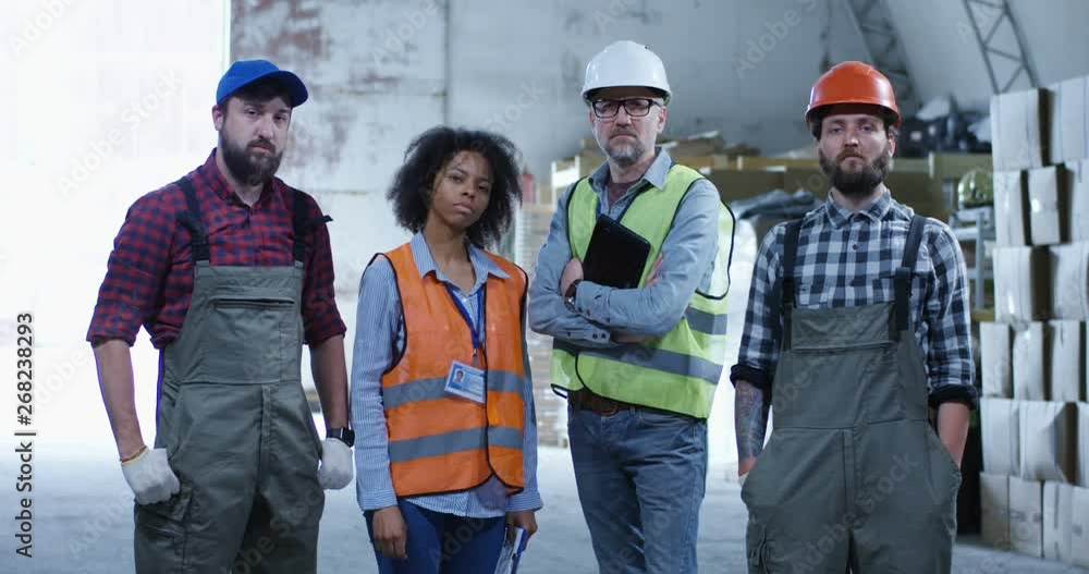 Happy staff posing in a warehouse Happy staff posing in a warehouse