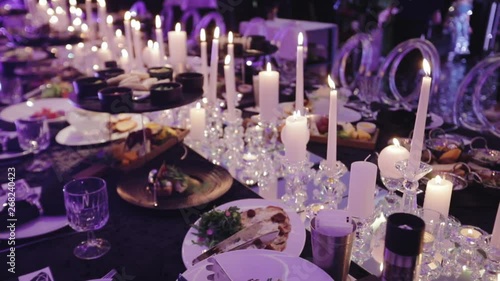 Festive table in a restaurant, people have dinner, celebration background