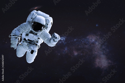 Alone single Astronaut in outer space. Science fiction wallpaper. Elements of this image were furnished by NASA.
