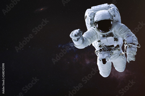 Astronaut in outer space. Science fiction wallpaper. Elements of this image were furnished by NASA.