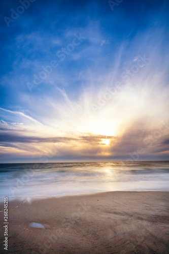 Bright sunset at the Cloudy Beach