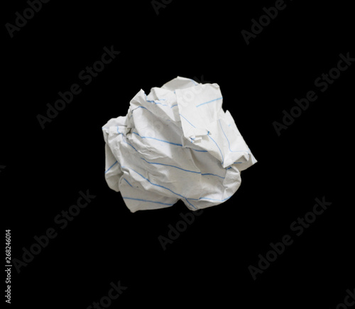 crumpled paper ball on black background