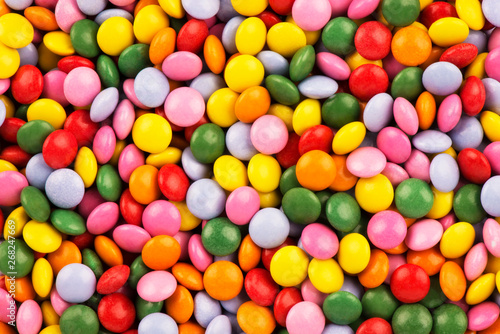 Top view on background texture of colorful hard candies. Copy space for your text.