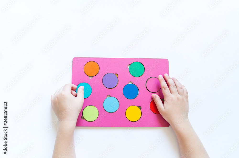 Naklejka premium Boy students Child's hands learning biology with montessori material