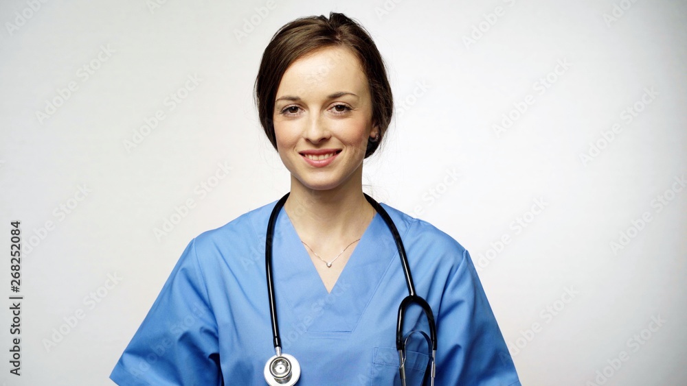Portrait of Smiling pediatrician with a stethoscope. Concept: profession, medicine, medical education. Portrait of Smiling pediatrician with a stethoscope. Concept: profession, medicine, medical education.