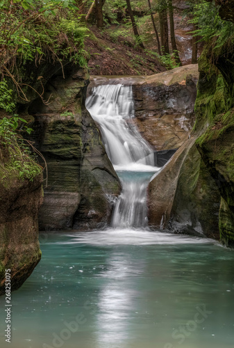 Downstream from the Devils Bathtub - The creek in the gorge in the Old Man   s Cave sector of Ohio   s Hocking Hills State Park  flows in and out of a chute in the sandstone called     The Devil   s Bathtub.   