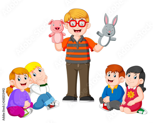 the teacher is doing the story telling with the doll in the hands