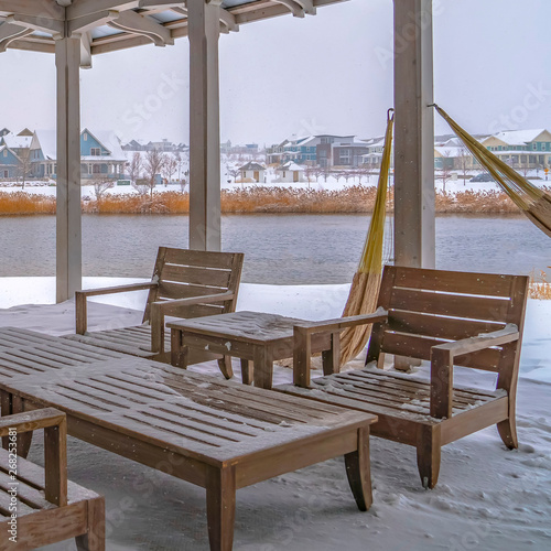 Square Snowy patio of a clubhouse overlooking Oquirh Lake