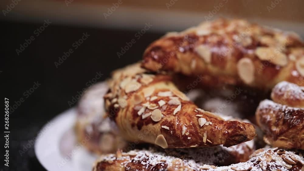 SLOW MOTION Shot of beautiful almond croissants in a plate being powdered with white sugar - 1080p Slide shot from Left to Right at 120fps SLOW MOTION Shot of beautiful almond croissants in a plate being powdered with white sugar - 1080p Slide shot from Left to Right at 120fps