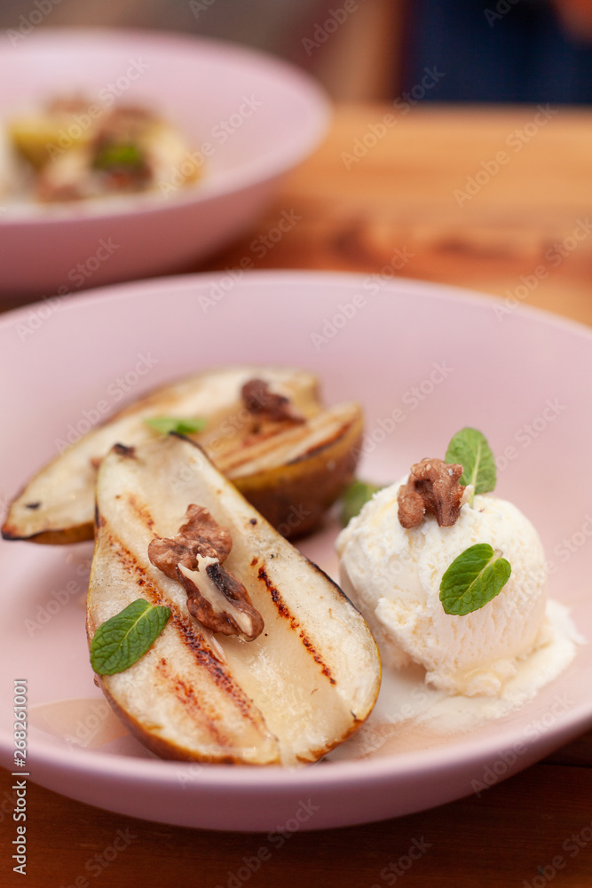 Sweet BBQ dessert: grilled pears with a nice scoop of vanilla ice cream Sweet BBQ dessert: grilled pears with a nice scoop of vanilla ice cream