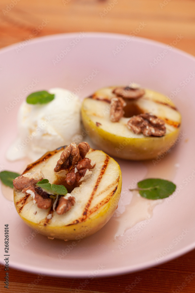 Sweet BBQ dessert: grilled apples with a nice scoop of vanilla ice cream Sweet BBQ dessert: grilled apples with a nice scoop of vanilla ice cream