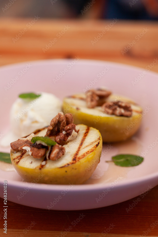Sweet BBQ dessert: grilled apples with a nice scoop of vanilla ice cream Sweet BBQ dessert: grilled apples with a nice scoop of vanilla ice cream
