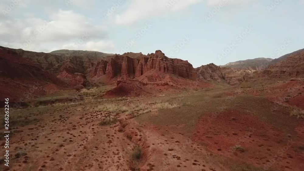 Small Creek Canyon with Red Cliffs named Konorcheck Canyon. Small canyon named Kyzyl Terek can be visited by walk. Great place to camp, hike explore on the way to Issyk Kul lake. Small Creek Canyon with Red Cliffs named Konorcheck Canyon. Small canyon named Kyzyl Terek can be visited by walk. Great place to camp, hike explore on the way to Issyk Kul lake.