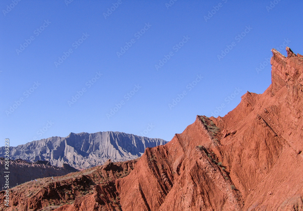 Red canyon mountain range and clear blue sky with copy space