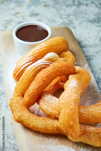 Churos spanish dessert. Gray textured background. Beautiful serving dishes. Dessert. Food chain