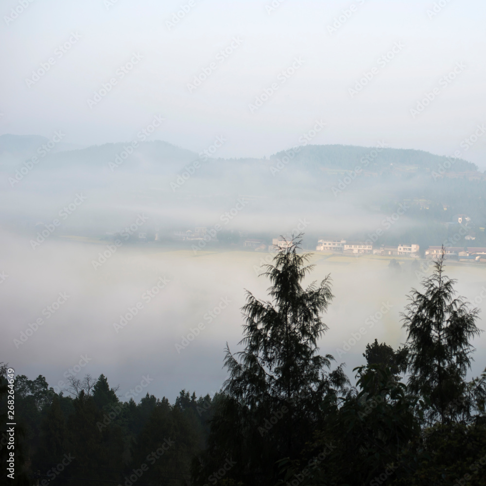 The mountain village in the morning mist The mountain village in the morning mist