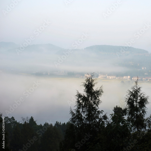 The mountain village in the morning mist