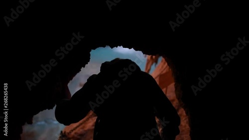 Walking through a cave to see havasupai waterfall.
