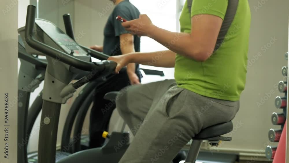 man on exercise bike in the gym. Healthy lifestyle concept man on exercise bike in the gym. Healthy lifestyle concept