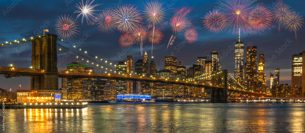 Banner Multicolor Firework Celebration over New york Cityscape with Brooklyn Bridge over the east river at the twilight time, USA downtown skyline, 4th of July and Independence day concept