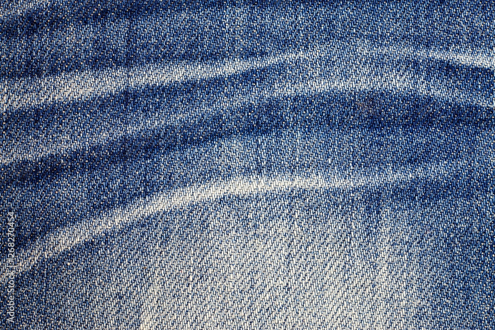 Naklejka premium Jeans torn denim texture background.