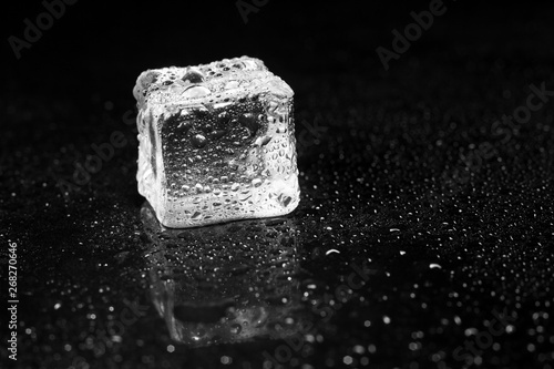 Fototapeta Naklejka Na Ścianę i Meble -  ice cubes on black table background.