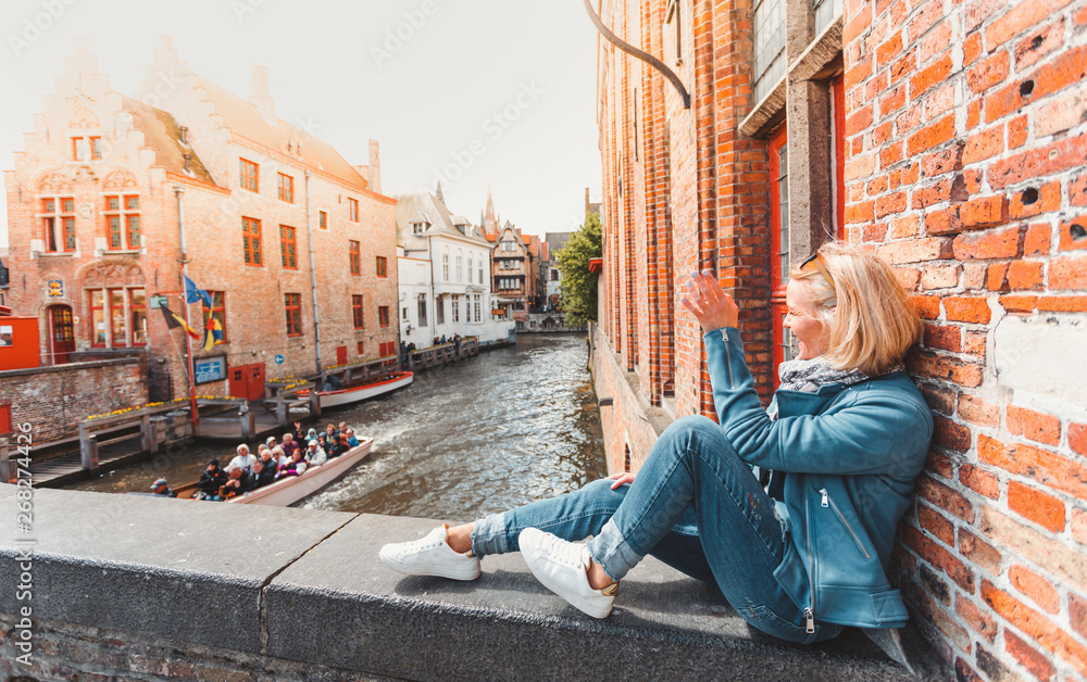 Fototapeta premium Woman tourist in Bruges. Country Sightseeing, Travel to Belgium