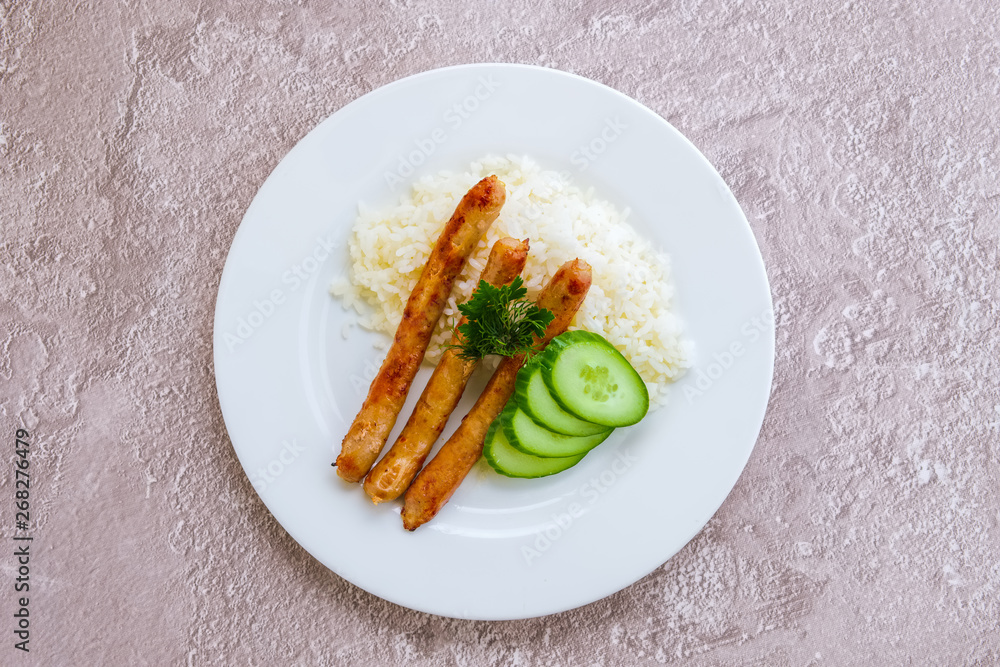 Fried sausage with mashed potato and fresh cucumber Fried sausage with mashed potato and fresh cucumber