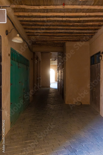 A narrow street in the old town of clay houses.