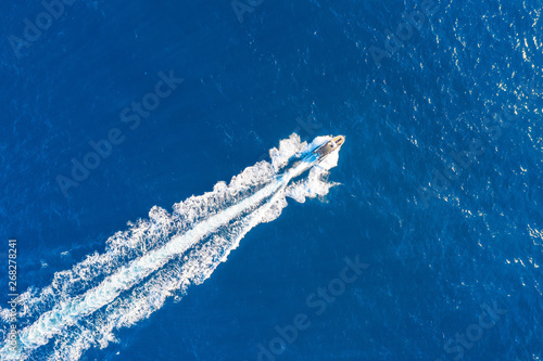 Boat launch at high speed floats in the Mediterranean, aerial top view. © aapsky