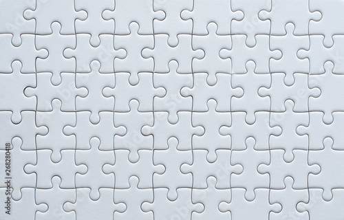 Jigsaw puzzle white color,Puzzle pieces grid photo