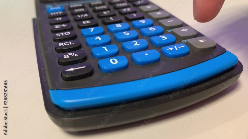 Calculating with the calculator, white background Calculating with the calculator, white background
