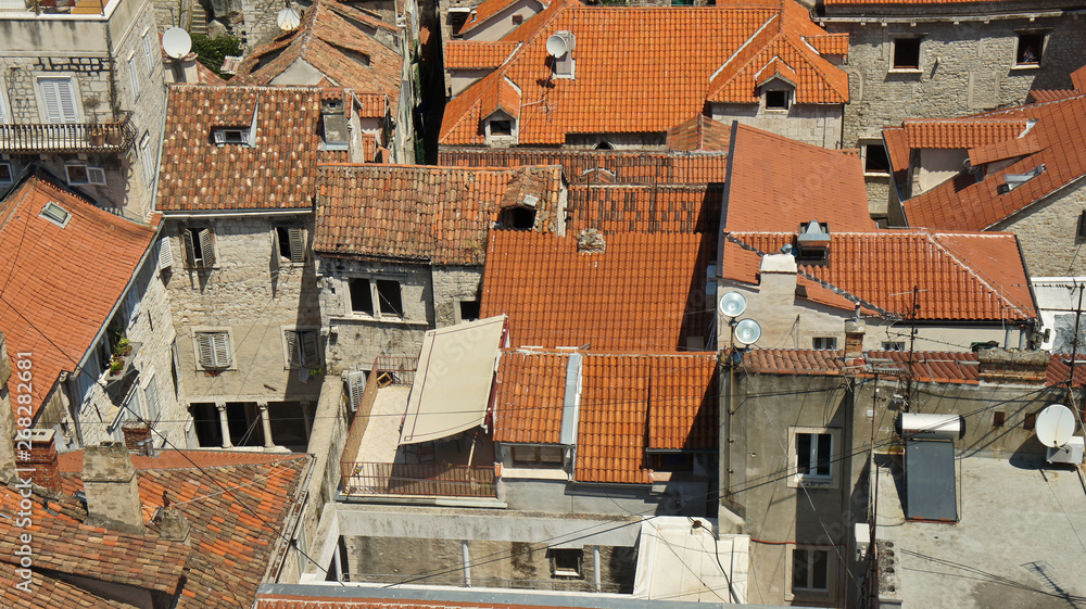 Scenic top view of the city from the bell tower, roofs of houses in old town, beautiful cityscape, sunny day, Split, Croatia