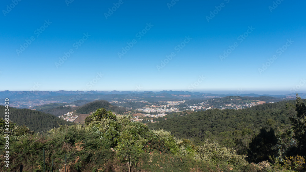 scenic view from Doddabetta peak, highest peak in nilgiri district, forest reserve with the blue sky background. 