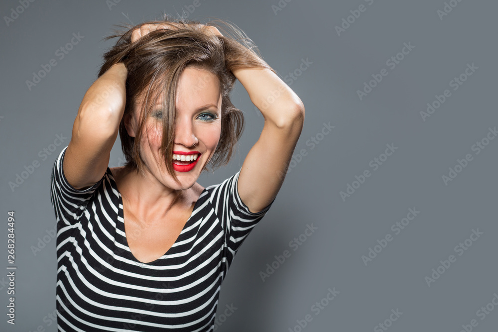 Cheerful woman in summer dress happy smiling, studio shot Cheerful woman in summer dress happy smiling, studio shot