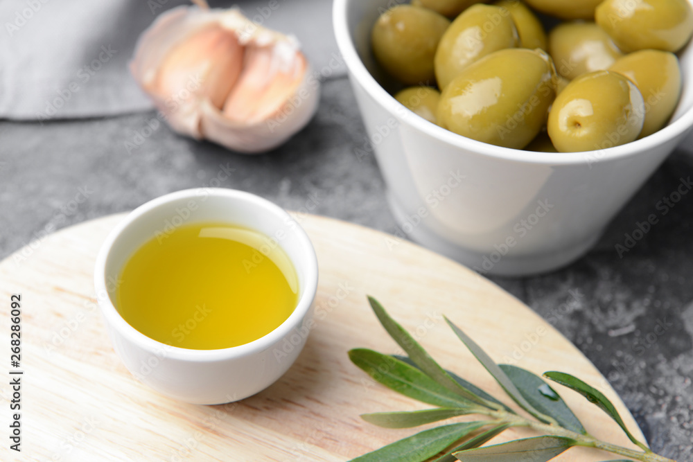 Bowl with tasty olive oil on table Bowl with tasty olive oil on table