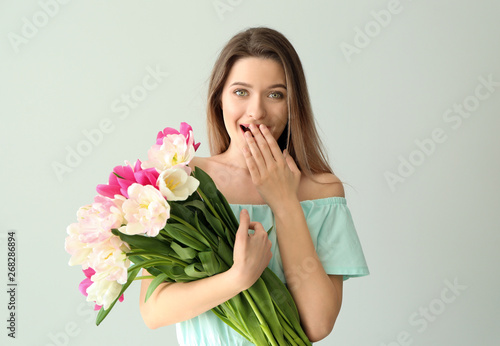 Surprised young woman with ...
