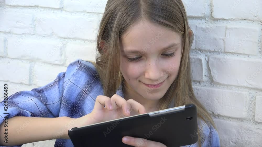 Child Playing Tablet, Kid Smartphone, Girl Reading Messages Browsing Internet Child Playing Tablet, Kid Smartphone, Girl Reading Messages Browsing Internet