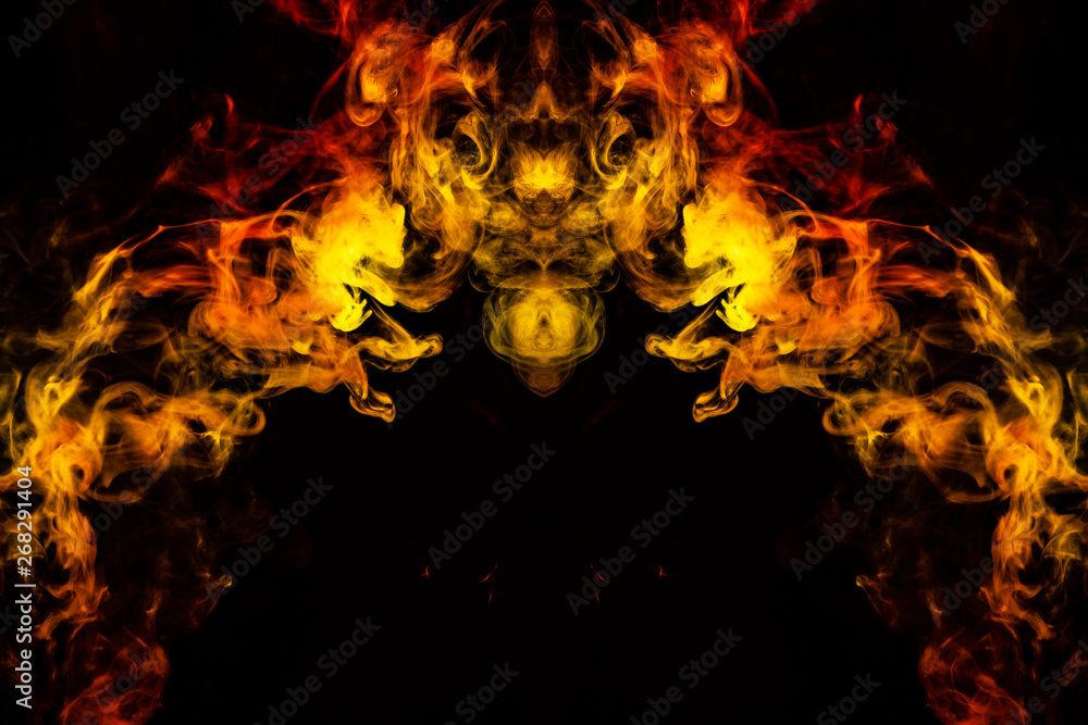 Abstract image of smoke of different green, yellow, orange and red colors in the form of horror in the shape of the head, face and eye on a black isolated background. Soul and ghost in mystical symbol Abstract image of smoke of different green, yellow, orange and red colors in the form of horror in the shape of the head, face and eye on a black isolated background. Soul and ghost in mystical symbol