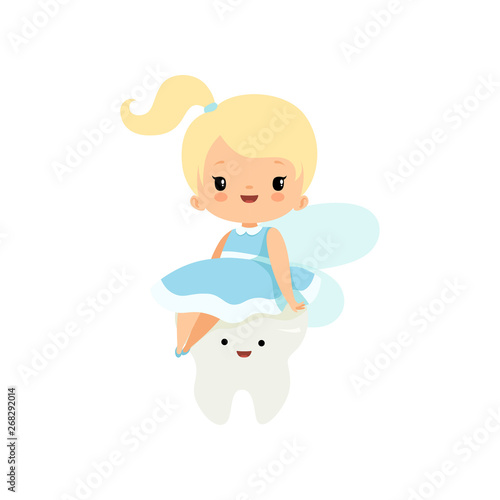Cute Little Tooth Fairy Sitting on Baby Tooth, Lovely Blonde Fairy Girl Cartoon Character in Light Blue Dress with Wings Vector Illustration