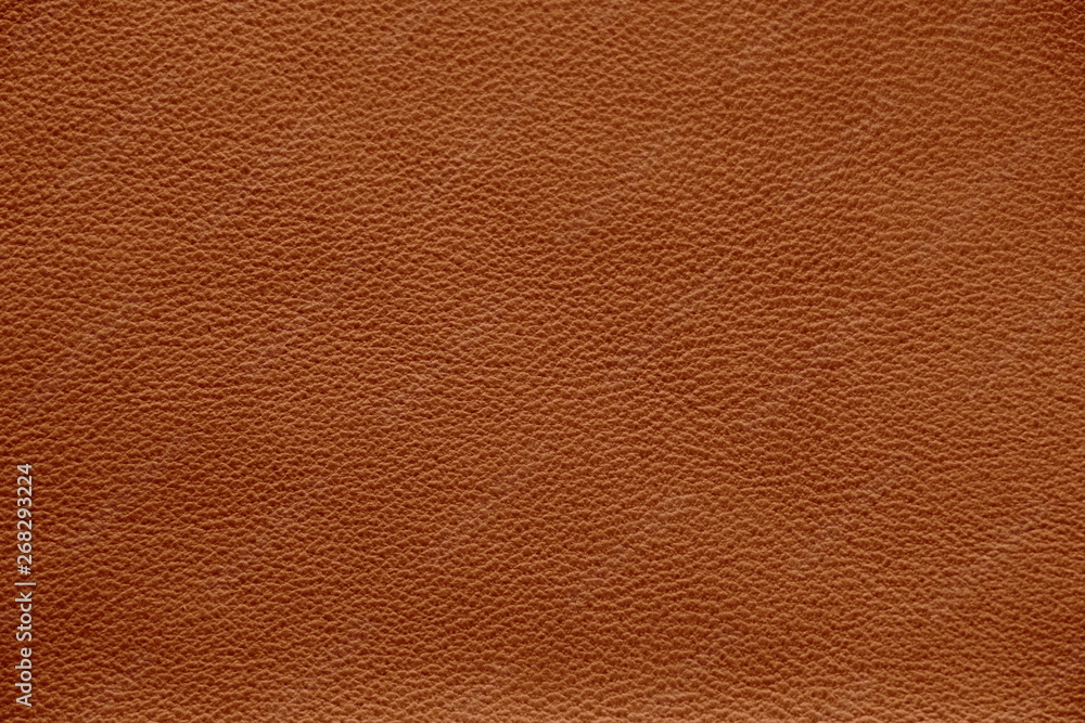 The texture of genuine leather. Natural skin texture close up. Brown background. The structure of the leather material brown shades. The texture of genuine leather. Natural skin texture close up. Brown background. The structure of the leather material brown shades.
