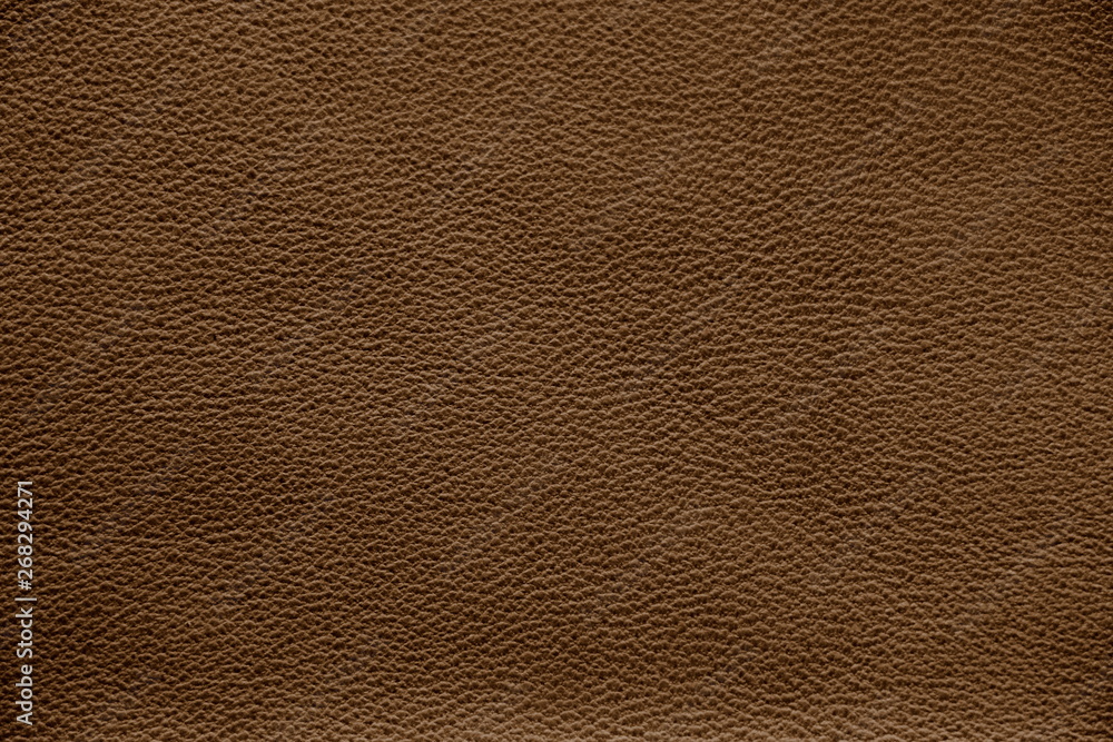 The texture of genuine leather. Impeccable and stylish background. Beautiful stylish background. Natural skin texture close up. Brown background. The structure of the leather material brown shades. The texture of genuine leather. Impeccable and stylish background. Beautiful stylish background. Natural skin texture close up. Brown background. The structure of the leather material brown shades.
