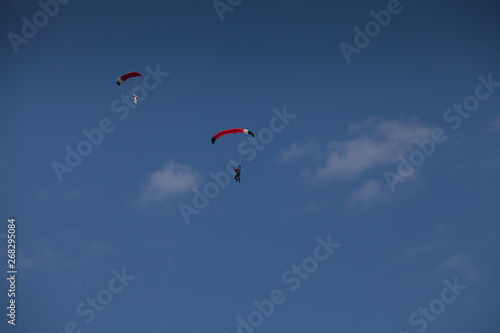 Skydive, people in the sky, under clouds