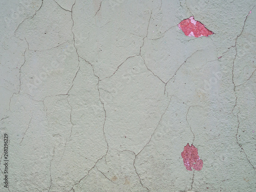 Old cracked paint on the concrete wall