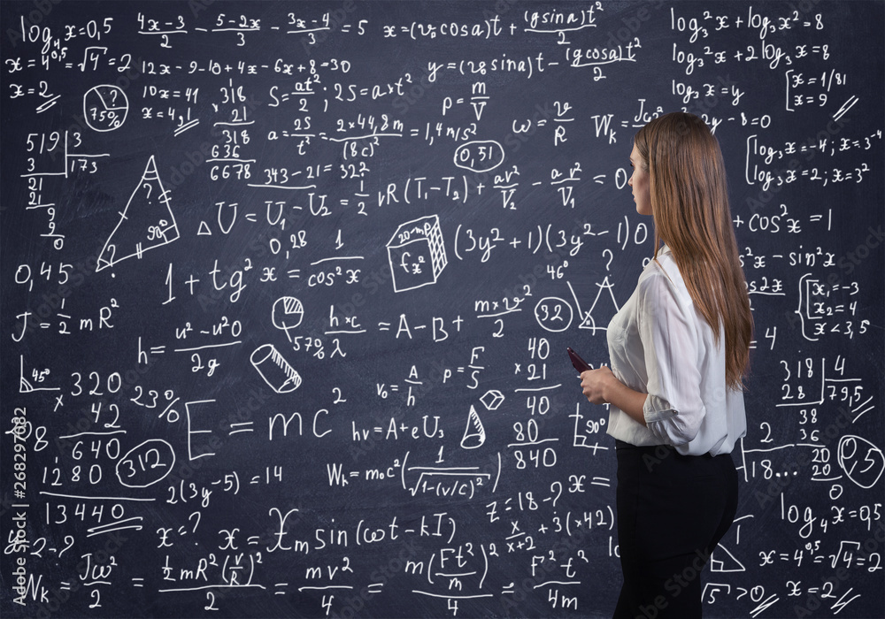 Beautiful woman thinking how to solve a math problem Beautiful woman thinking how to solve a math problem