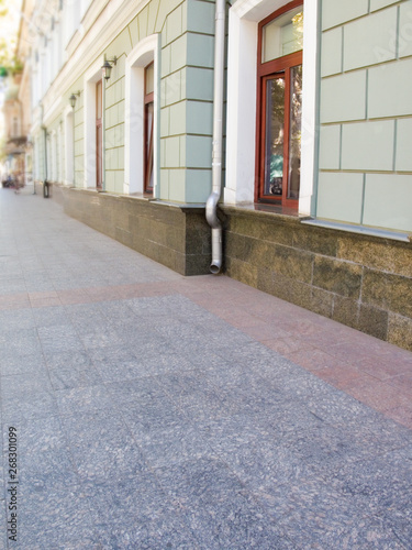 textured street wall. Facade of the house of a city street Background for model shooting © agusyonok