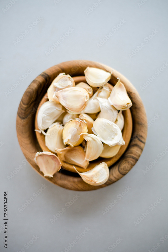 Small Wooden Bowls Garlic Cloves Table close up top view Small Wooden Bowls Garlic Cloves Table close up top view