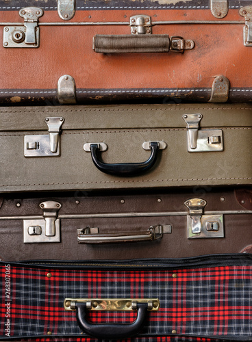 Various stacked old luggage bags photo