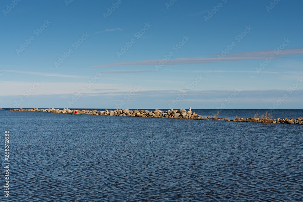 Stone Harbor in the Baltic sea, calm sea, stone shore