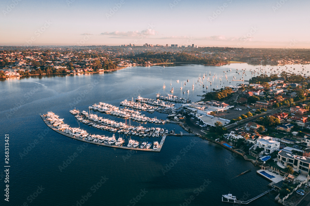 Aerial coastline view of sea bay with yachts at sunrise, Sydney, Australia